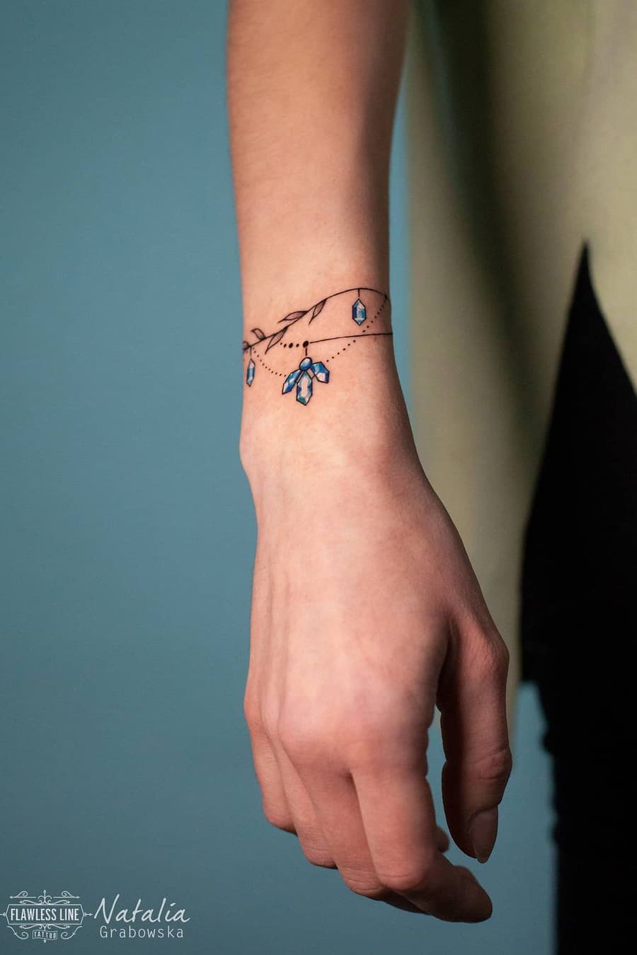 Sapphire bracelet tattoo