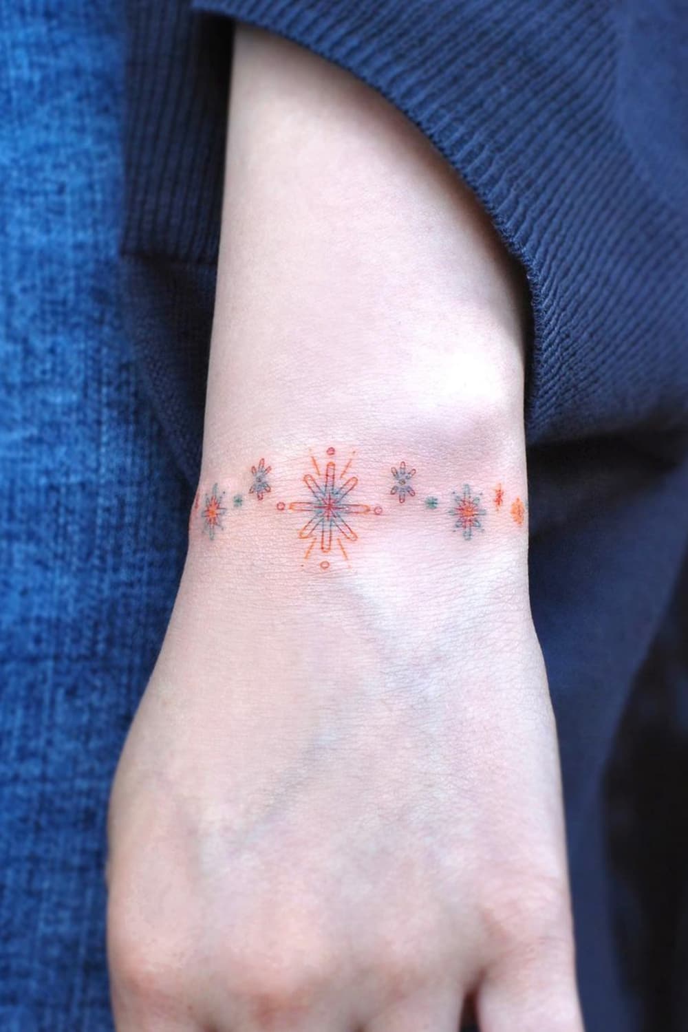 Symbol flower armband tattoo