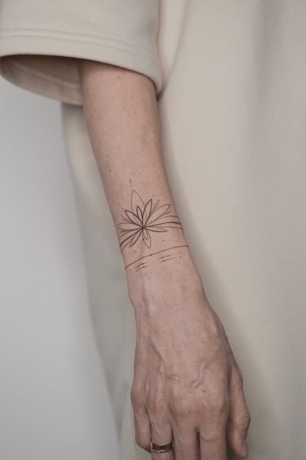 Lotus armband tattoo