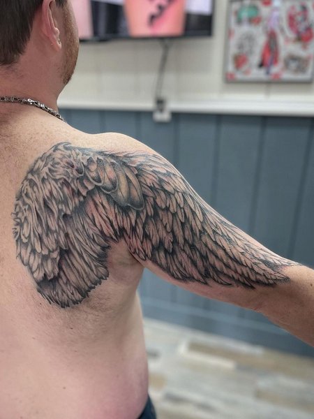 Angel Wings Half Sleeve Tattoo