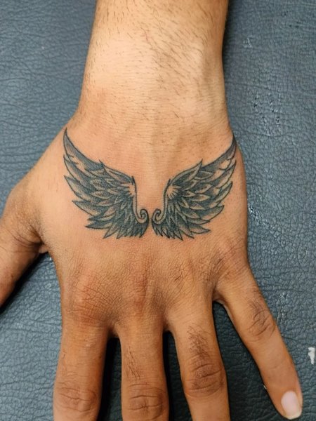 Angel Wings Hand Tattoo