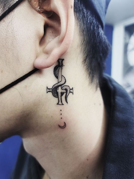Cross Behind the Ear Tattoo