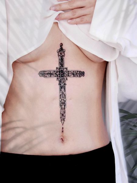Cross Stomach Tattoo