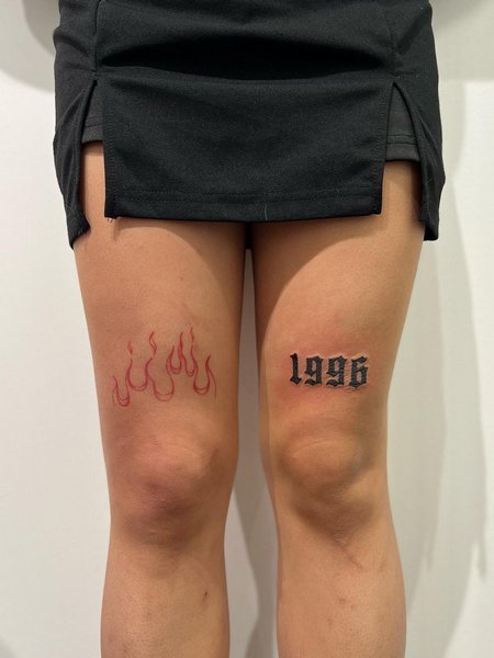 Flame Thigh Tattoo