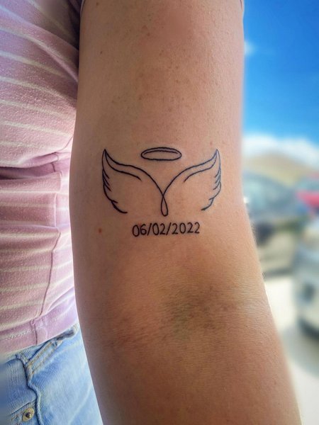 Meaningful Angel Wing Tattoo