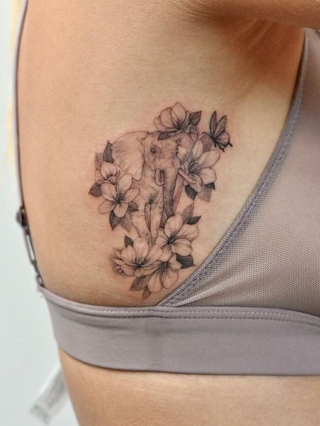 Elephant Tattoo With Flowers