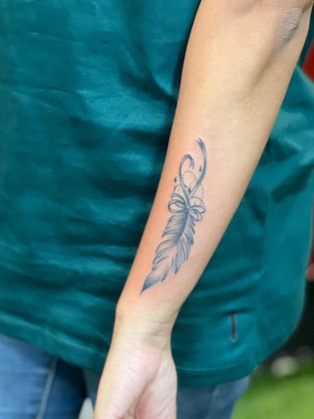 Feather Forearm Tattoo