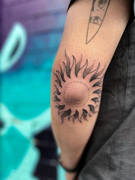 Sun Elbow Tattoo