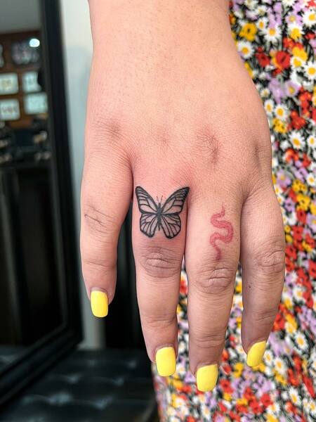 Butterfly And Snake Finger Tattoo