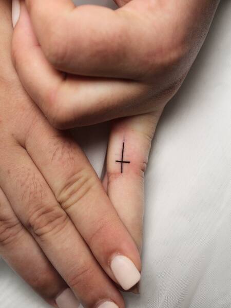 Cross Finger Tattoo