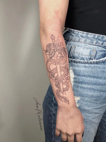 Dragon and sword tattoo