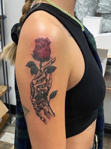 Rose And Skeleton Hand Tattoo