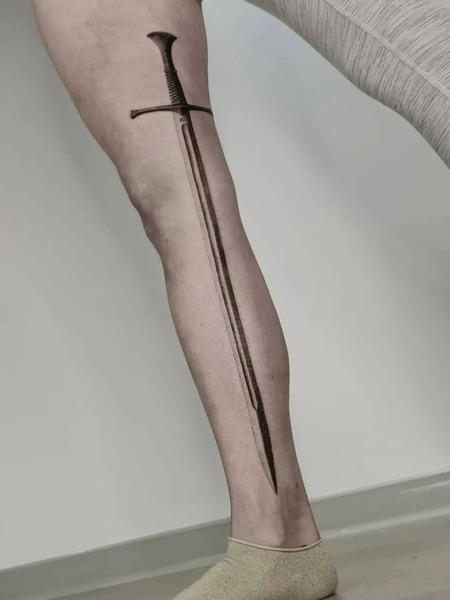 Sword tattoo on leg