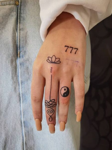 Unalome Lotus Flower Finger Tattoo