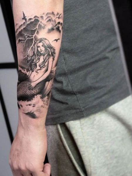 Arm mermaid tattoo