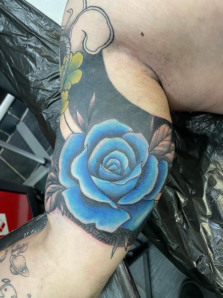 Blue Rose Tattoo On Bicep