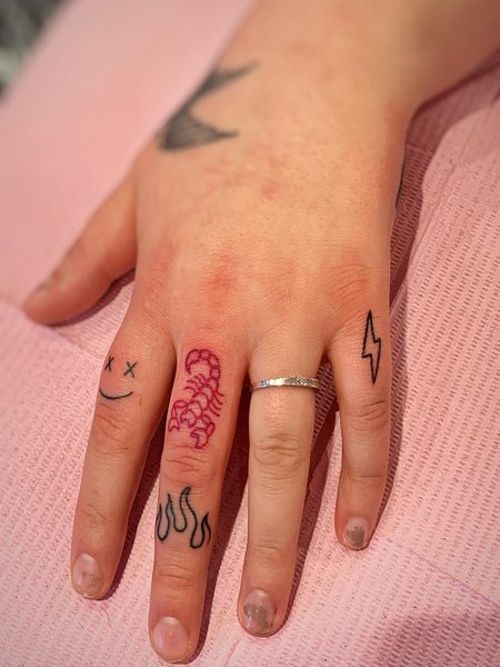 Scorpion Tattoo On Finger