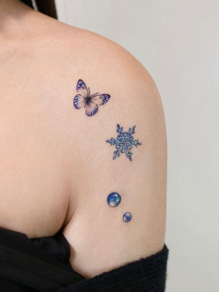 Snowflake And Butterfly Tattoo