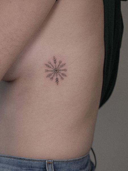 Snowflake Rib Tattoo
