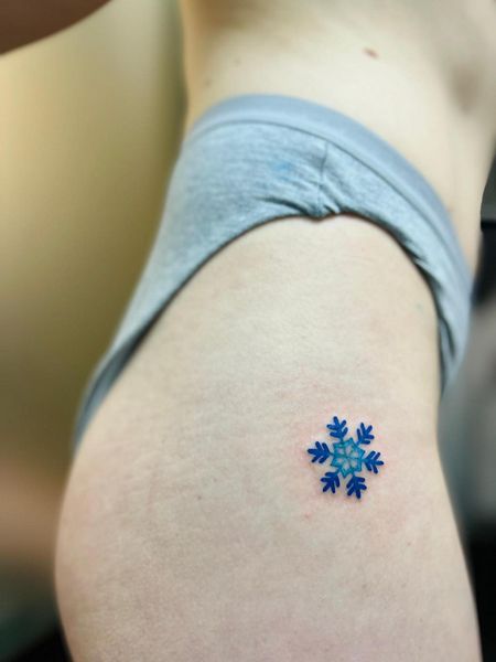 Snowflake Thigh Tattoo