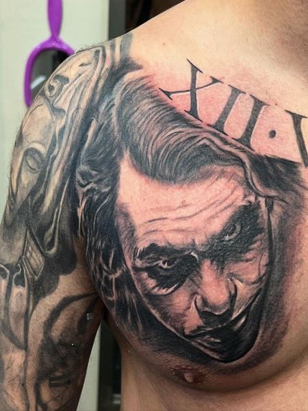 joker chest tattoo