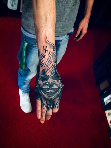 joker hand tattoo