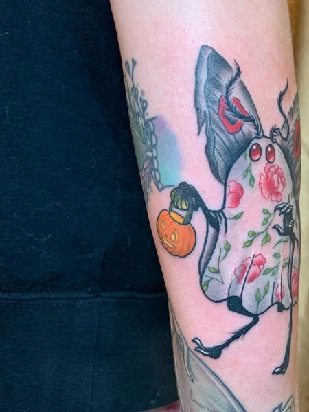 Flower and Mothman Tattoo
