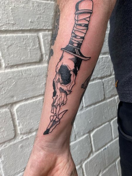 Skull And Dagger Tattoos