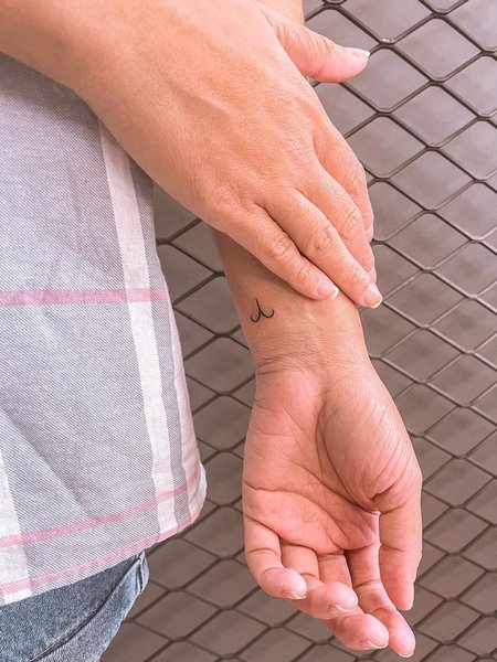 Tiny Aries Sign Tattoo