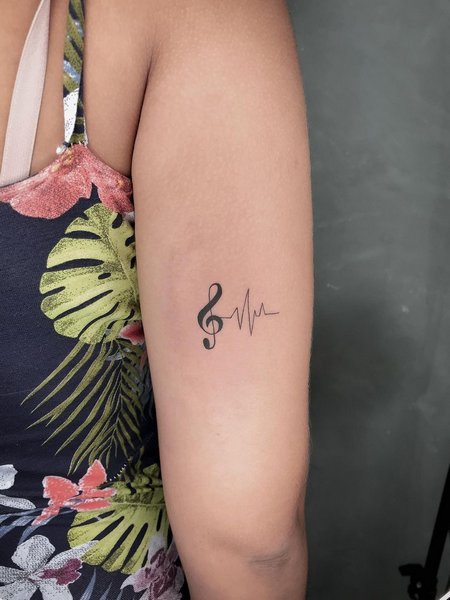 Meaningful Music Note Tattoo