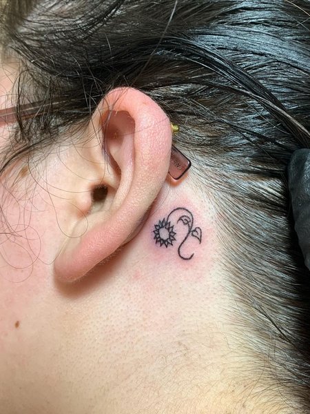 Leo Behind Ear Tattoo